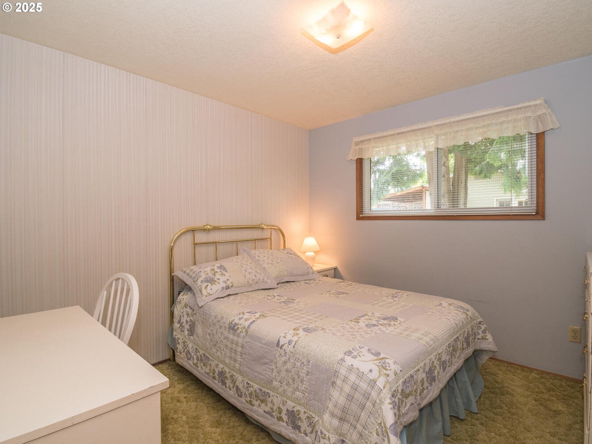 19838 Northeast Wasco Street Portland, OR 97230 - Photo 29 of 42 a bedroom with a bed and a window