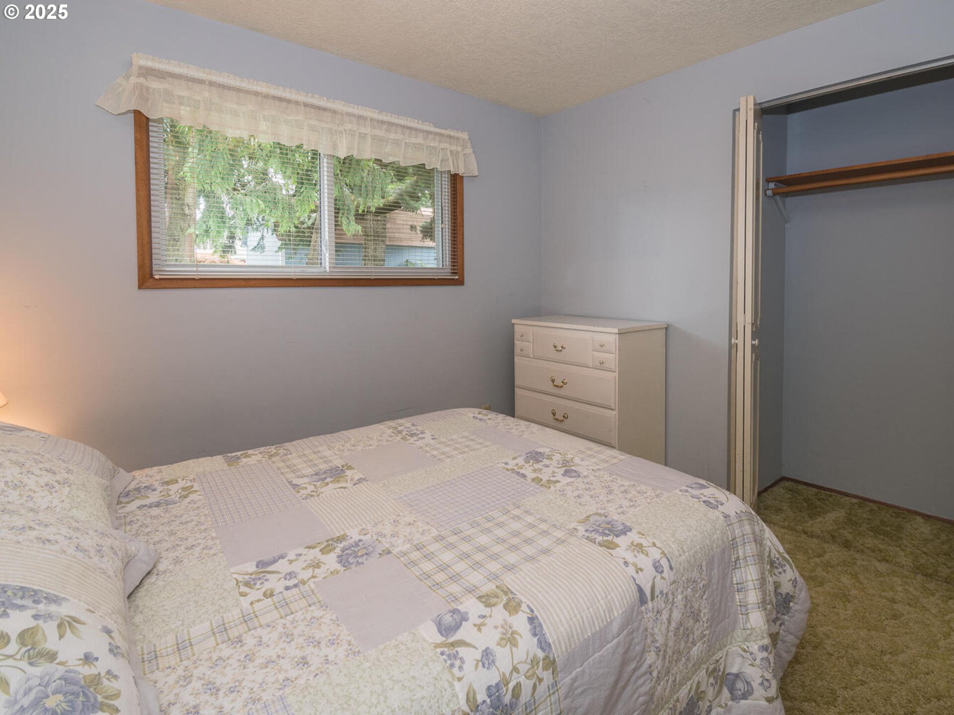19838 Northeast Wasco Street Portland, OR 97230 - Photo 30 of 42 a bedroom with a bed and a window