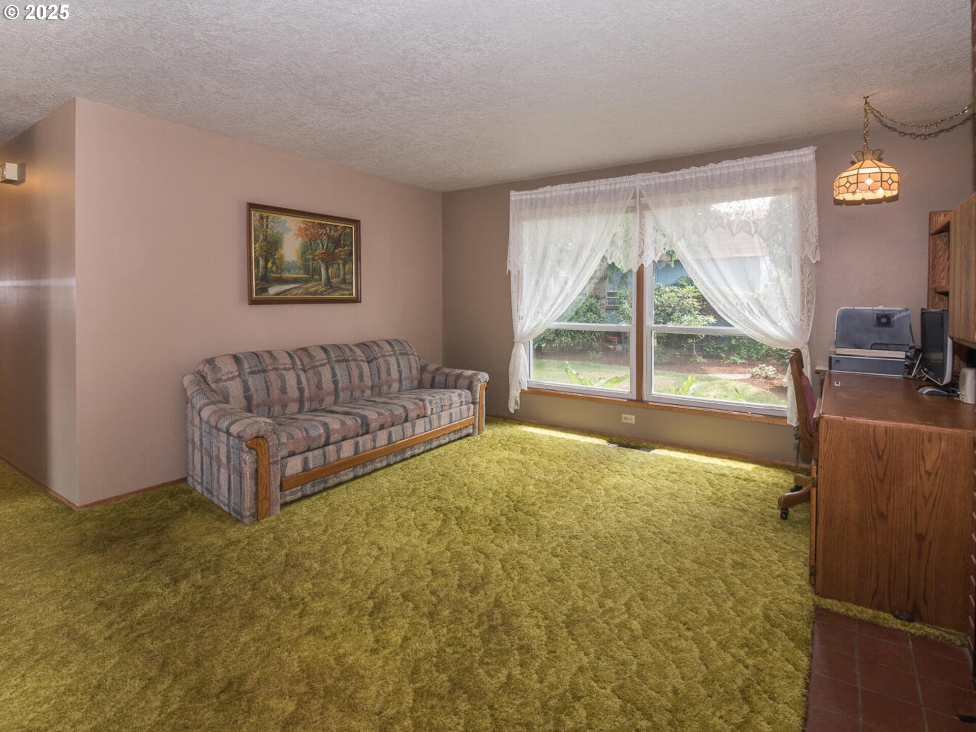 19838 Northeast Wasco Street Portland, OR 97230 - Photo 33 of 42 a living room with a bed furniture and a large window
