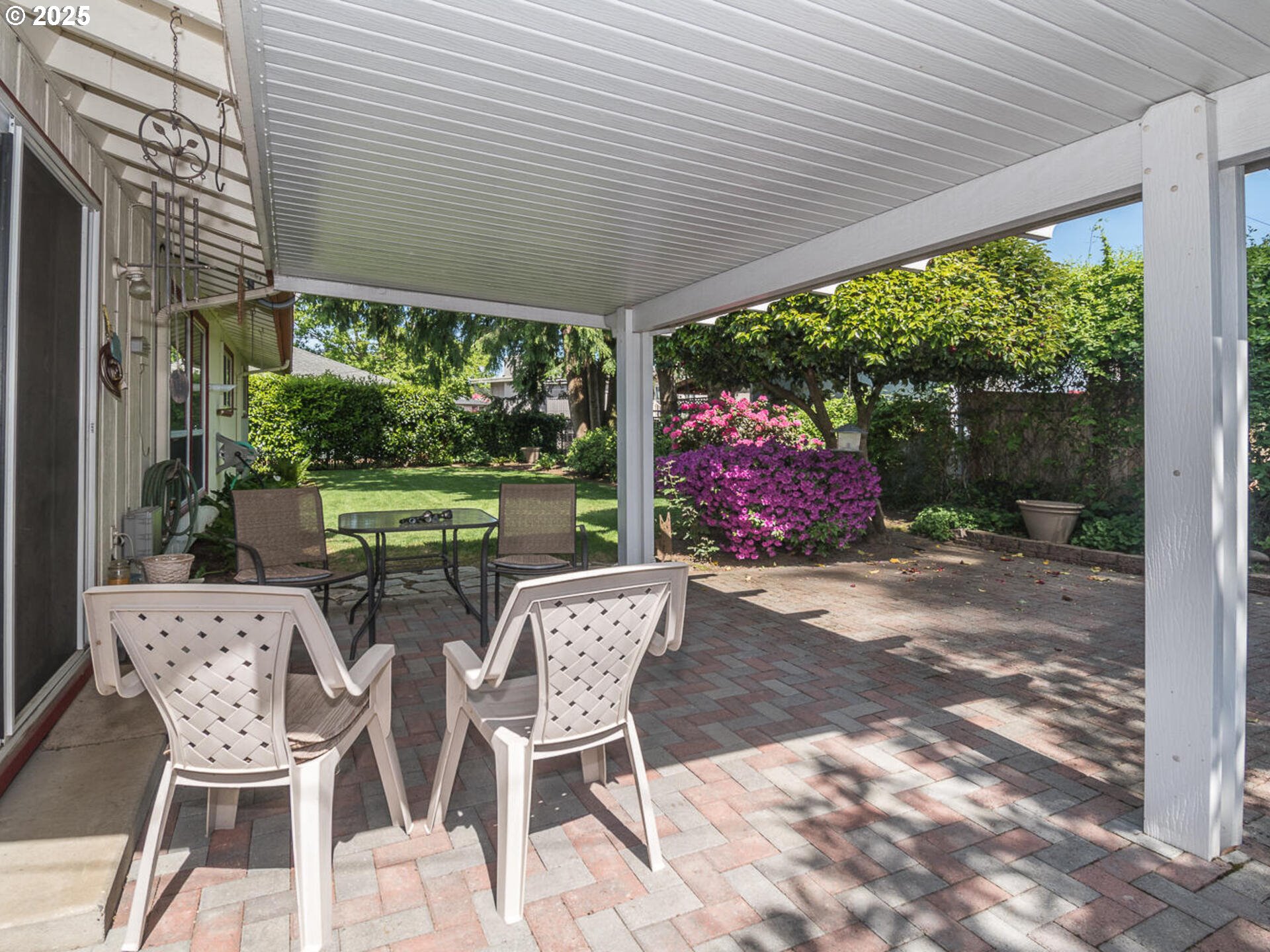 19838 Northeast Wasco Street Portland, OR 97230 - Photo 39 of 42 a patio with table and chairs and potted plants