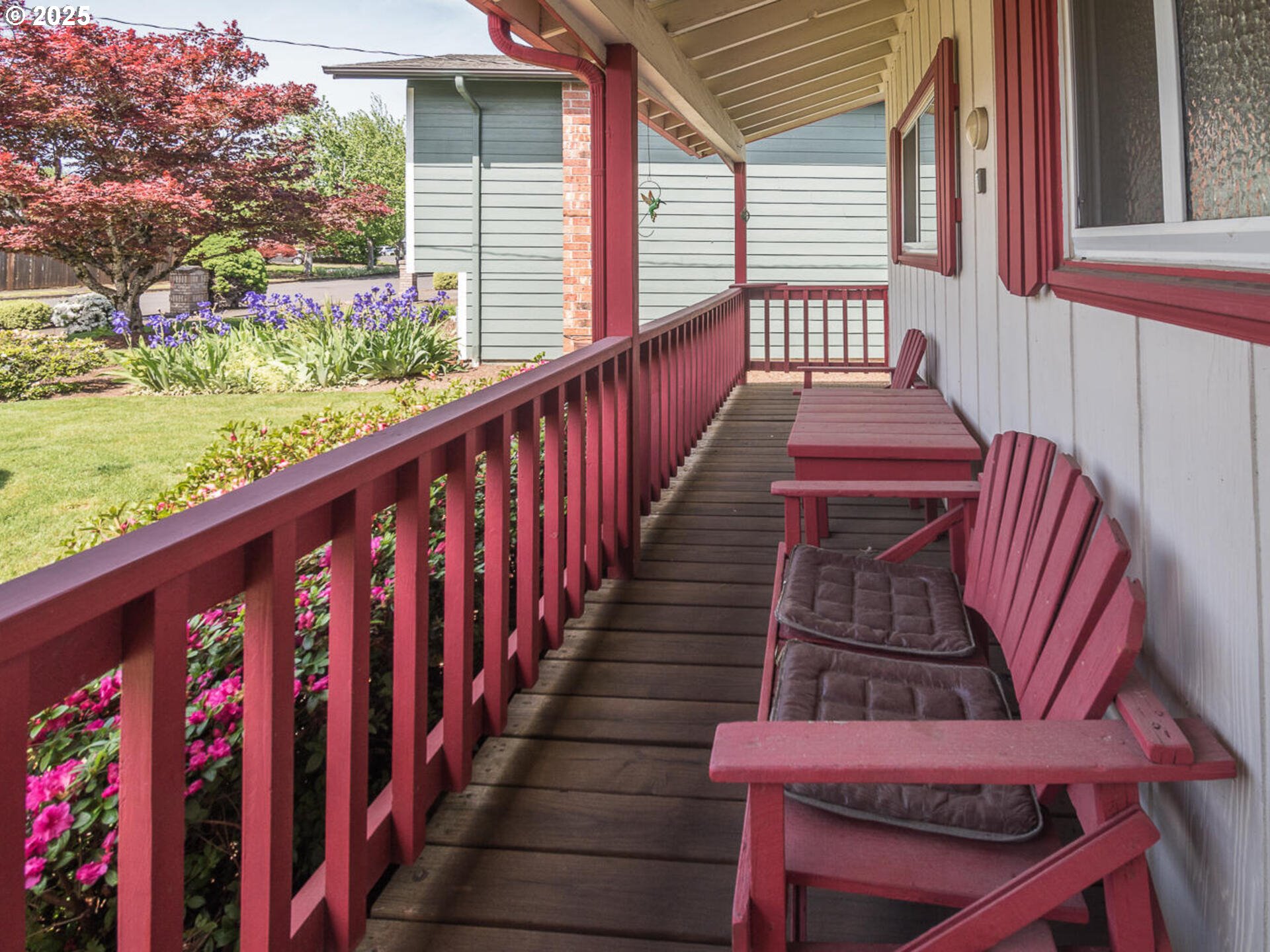 19838 Northeast Wasco Street Portland, OR 97230 - Photo 7 of 42 a balcony with wooden floor outdoor seating and yard in the back