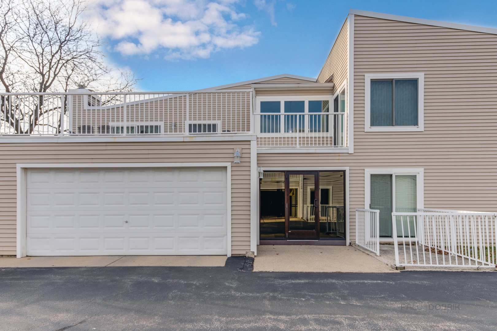 a front view of a house with a garage