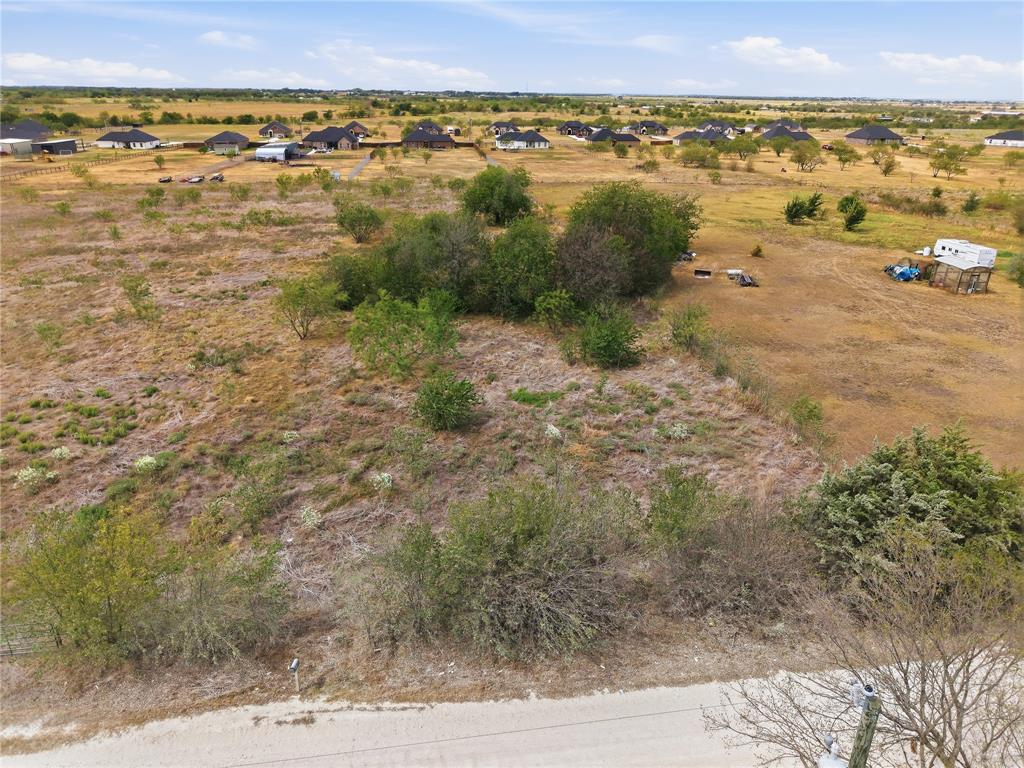 0 Northeast CR 1060 Rice, TX 75155 - Photo 5 of 30 Expansive open land featuring natural vegetation and distant residential structures under a clear sky