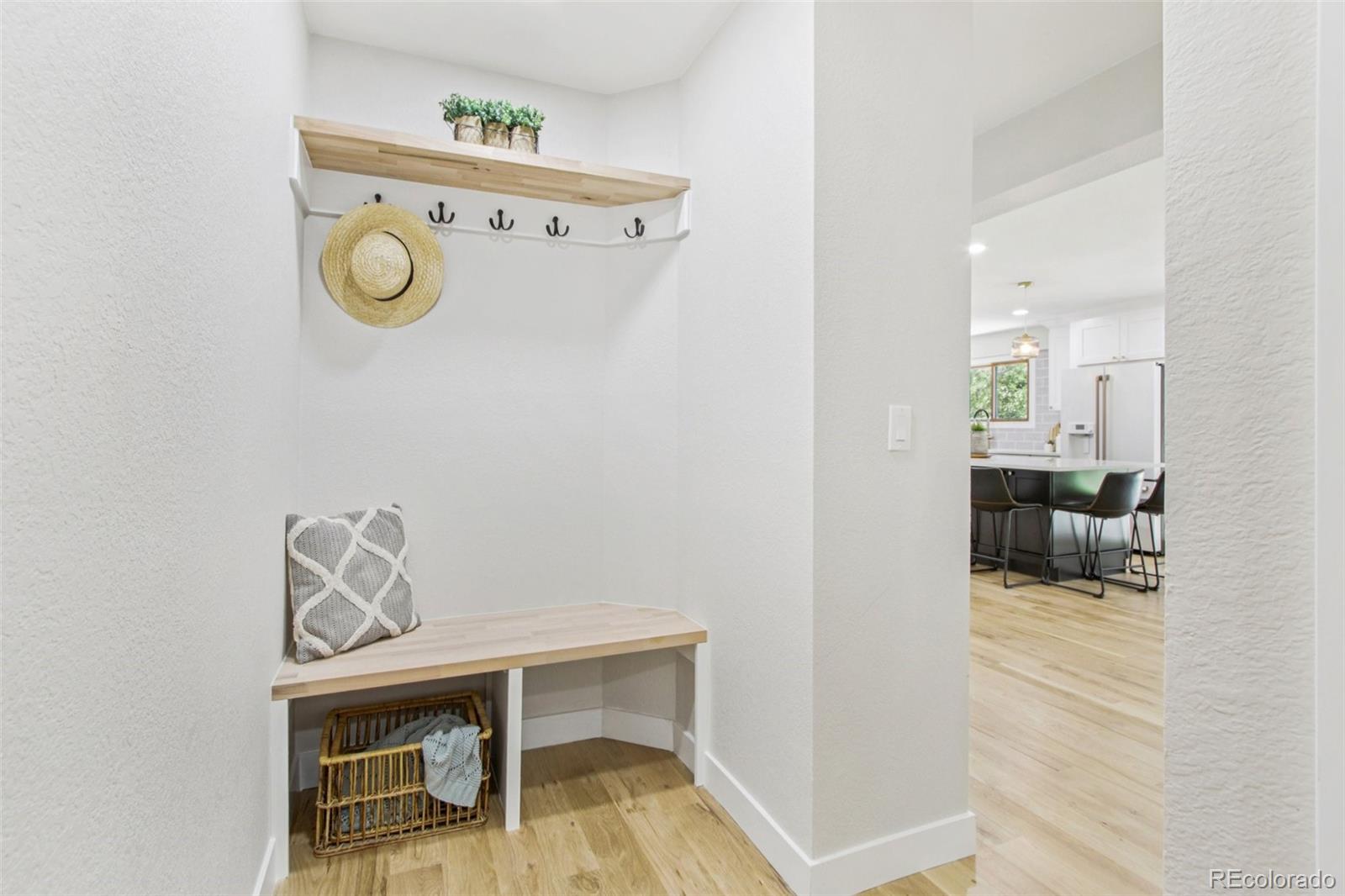 9810 Venneford Ranch Road Highlands Ranch, CO 80126 - Photo 18 of 50 a view of livingroom with furniture and wooden floor