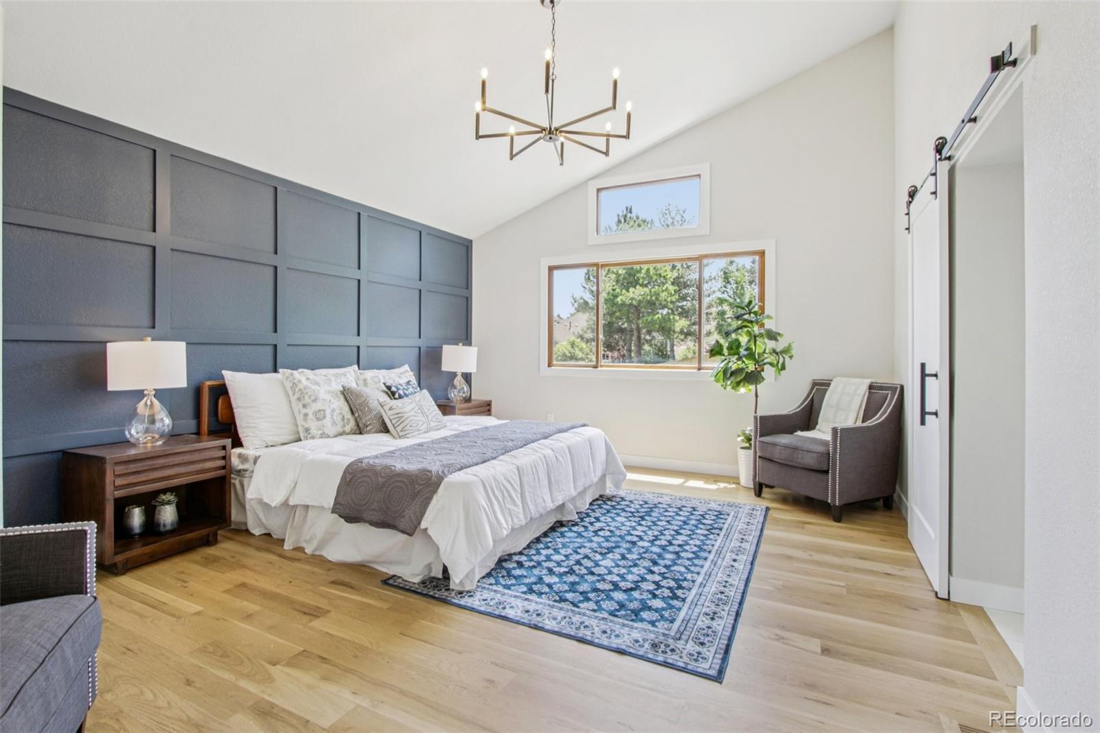 9810 Venneford Ranch Road Highlands Ranch, CO 80126 - Photo 22 of 50 a bedroom with furniture and a window