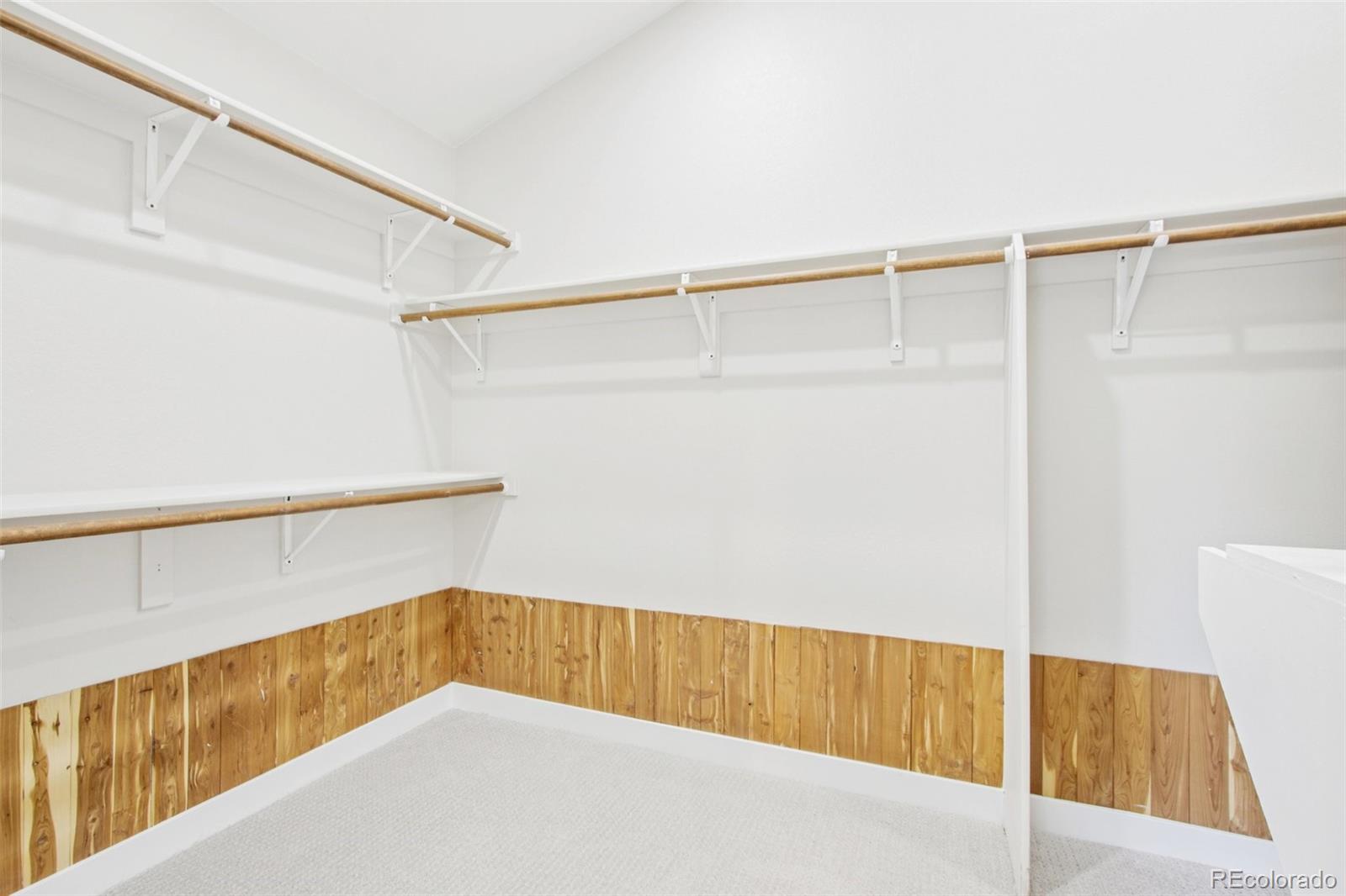 9810 Venneford Ranch Road Highlands Ranch, CO 80126 - Photo 26 of 50 a view of an empty walk in closet