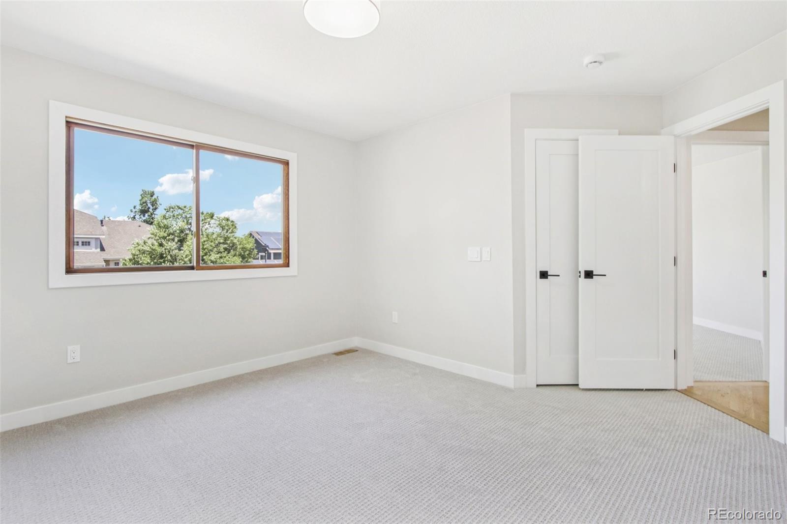 9810 Venneford Ranch Road Highlands Ranch, CO 80126 - Photo 27 of 50 a view of an empty room with a window