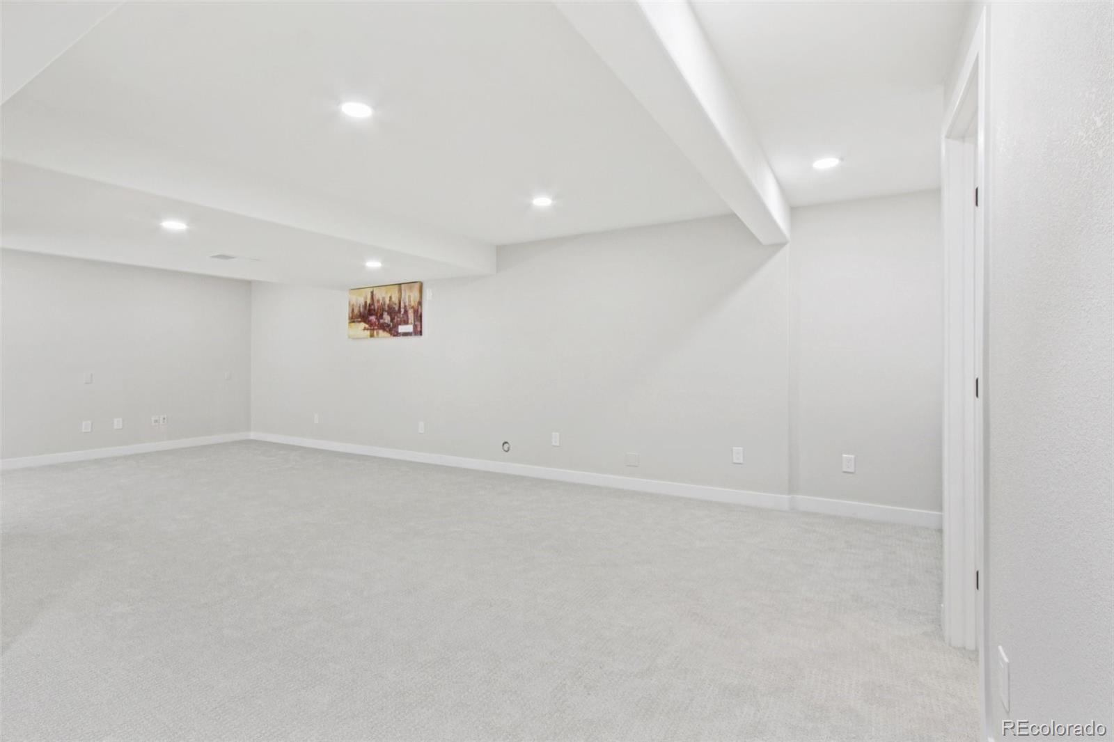 9810 Venneford Ranch Road Highlands Ranch, CO 80126 - Photo 30 of 50 an empty room with a empty space