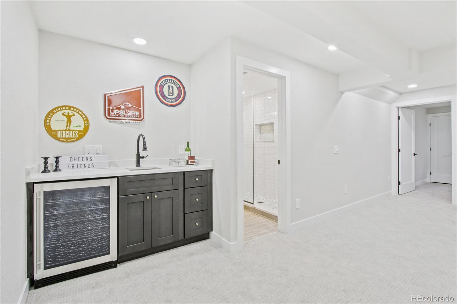 9810 Venneford Ranch Road Highlands Ranch, CO 80126 - Photo 34 of 50 a spacious bathroom with a sink and a area