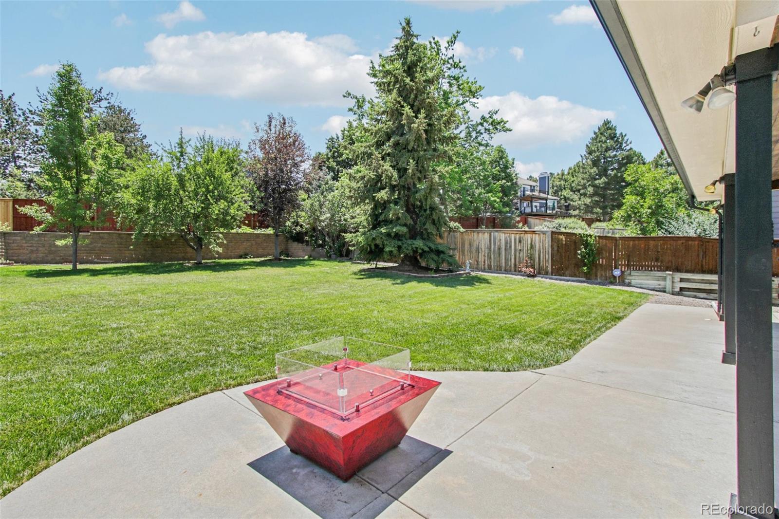 9810 Venneford Ranch Road Highlands Ranch, CO 80126 - Photo 40 of 50 a view of a backyard with sitting area