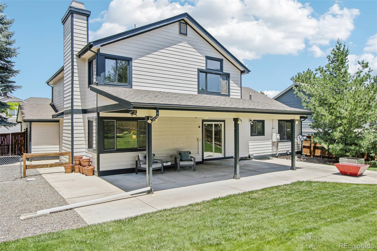 9810 Venneford Ranch Road Highlands Ranch, CO 80126 - Photo 42 of 50 a view of a house with sitting area and garden