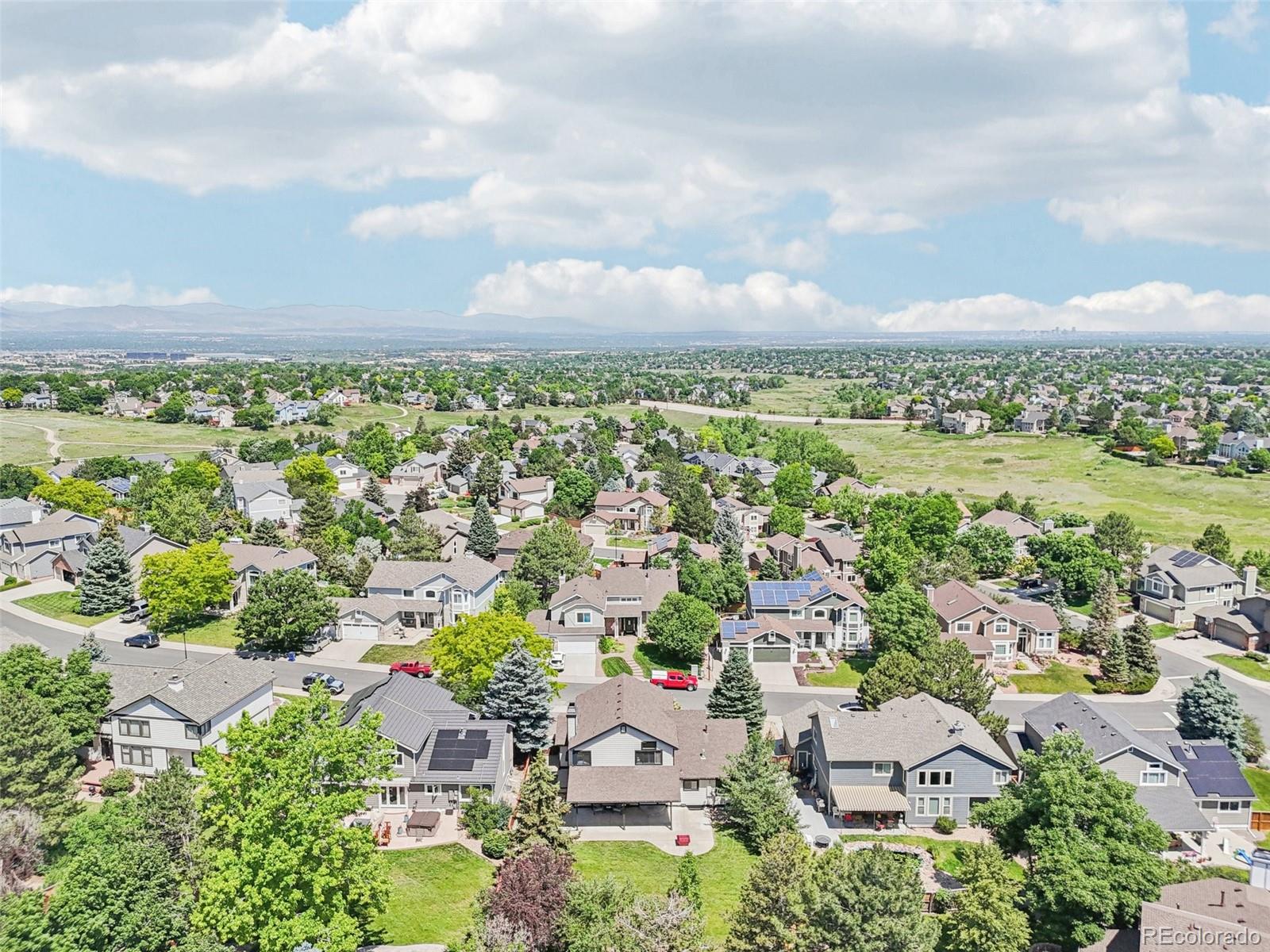 9810 Venneford Ranch Road Highlands Ranch, CO 80126 - Photo 44 of 50 an aerial view of residential building and trees