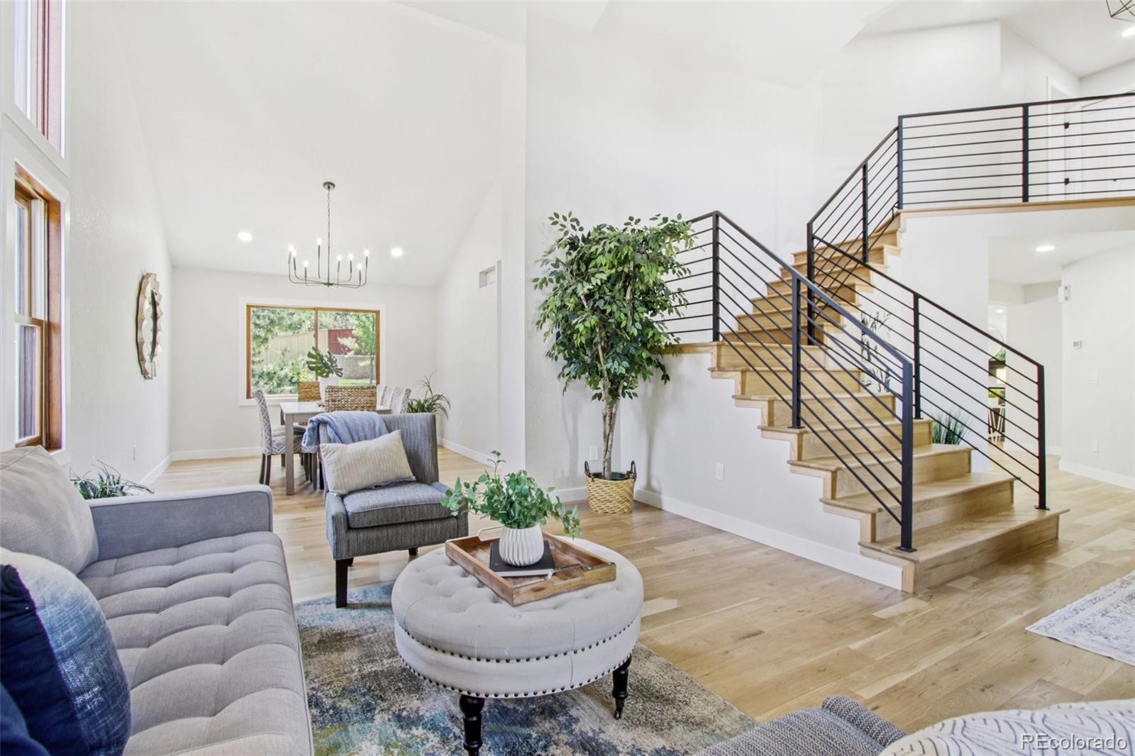 9810 Venneford Ranch Road Highlands Ranch, CO 80126 - Photo 6 of 50 a living room with furniture and a potted plant
