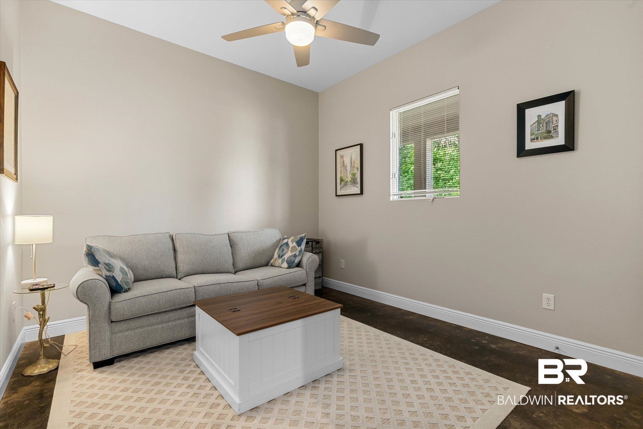 3400 Rue Royal Mobile, AL 36693 - Photo 18 of 33 Living room featuring ceiling fan and concrete flooring