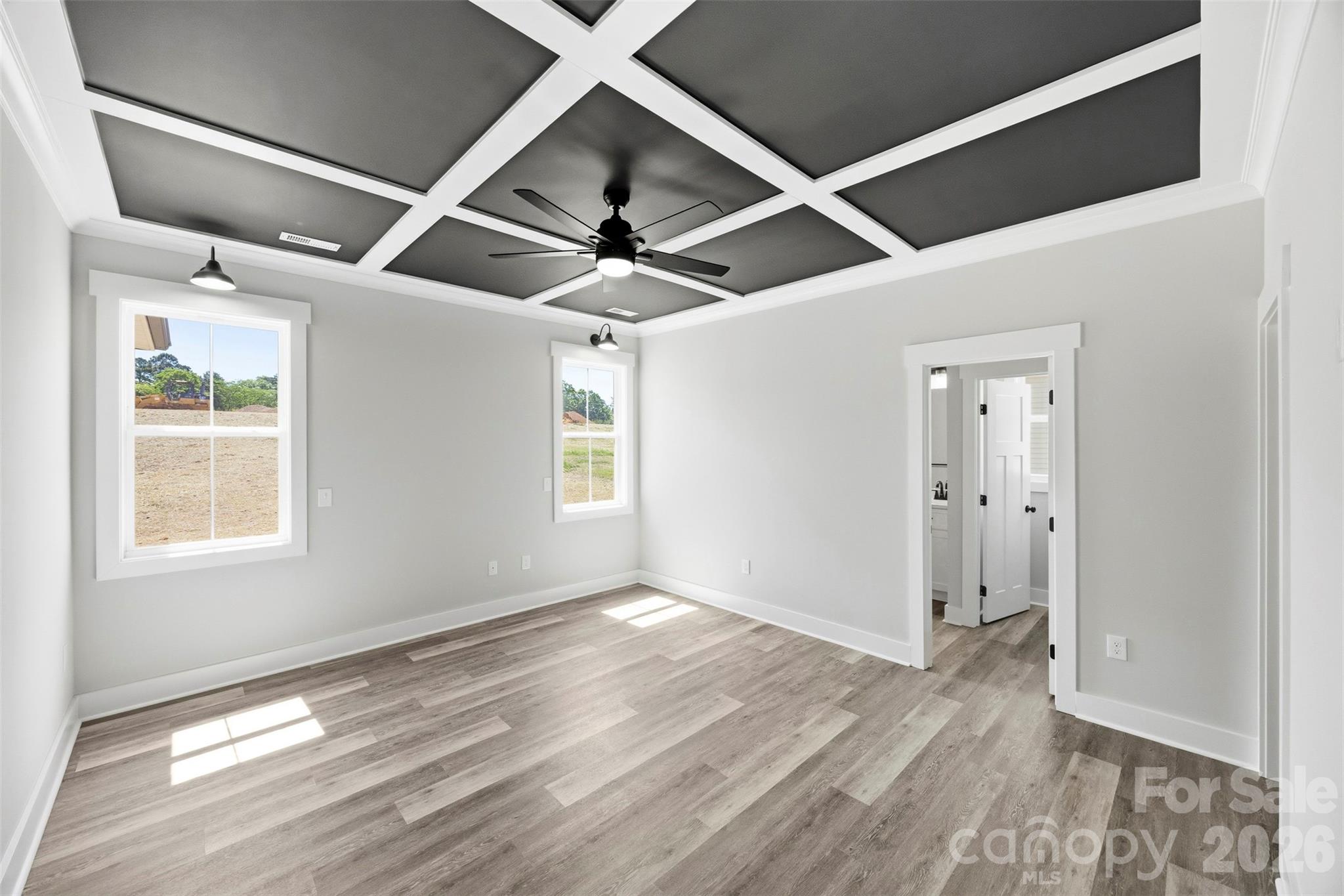 1014 Speight Road Albemarle, NC 28001 - Photo 14 of 28 an empty room with wooden floor and windows