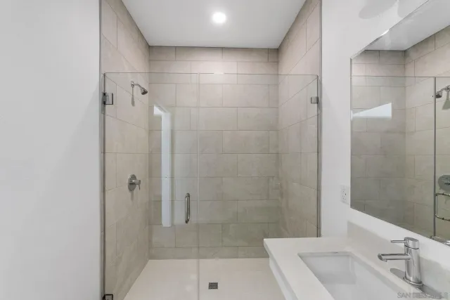 a bathroom with a sink and shower