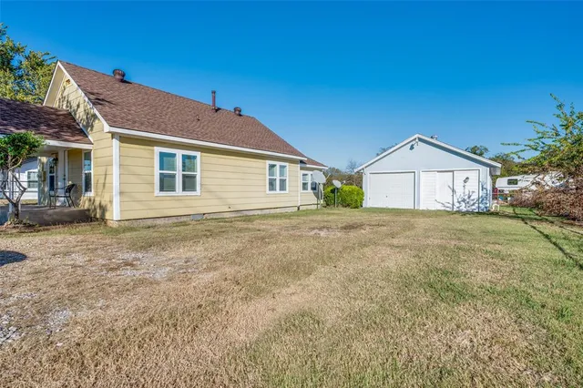 a house with yard in front of it
