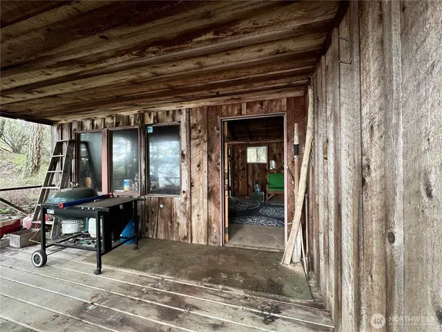 a room with a bed a mirror and a window