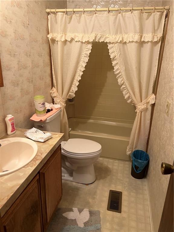42686 Gilson Ridge Road Titusville, PA 16354 - Photo 18 of 19 a bathroom with a sink toilet and shower