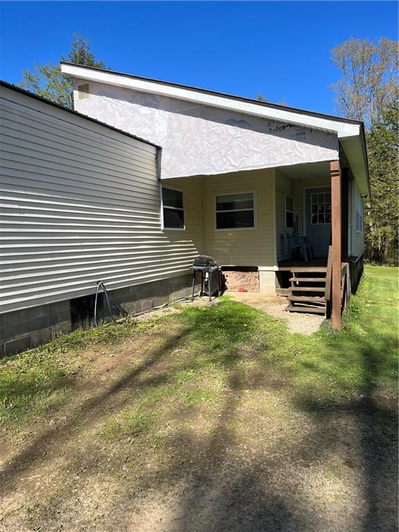 42686 Gilson Ridge Road Titusville, PA 16354 - Photo 2 of 19 a view of a house with backyard and sitting area