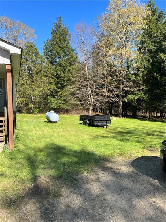 42686 Gilson Ridge Road Titusville, PA 16354 - Photo 6 of 19 a view of a house with a yard