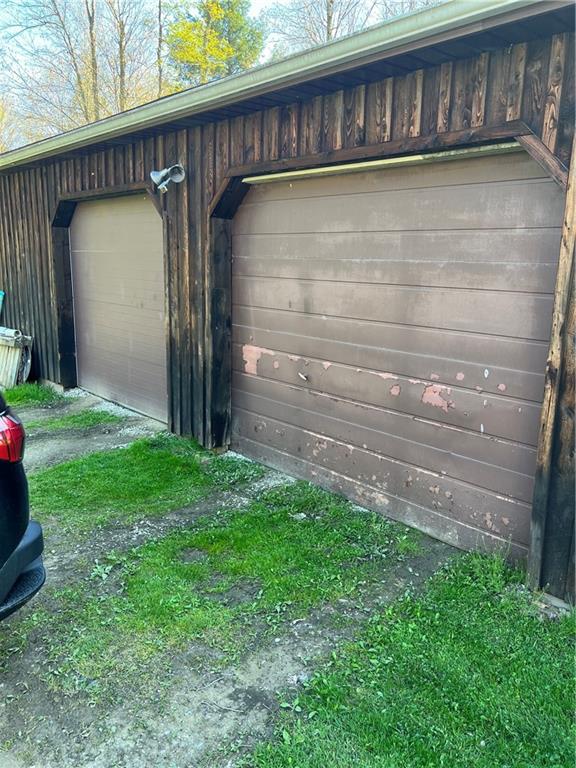 42686 Gilson Ridge Road Titusville, PA 16354 - Photo 7 of 19 a front view of a house with a yard