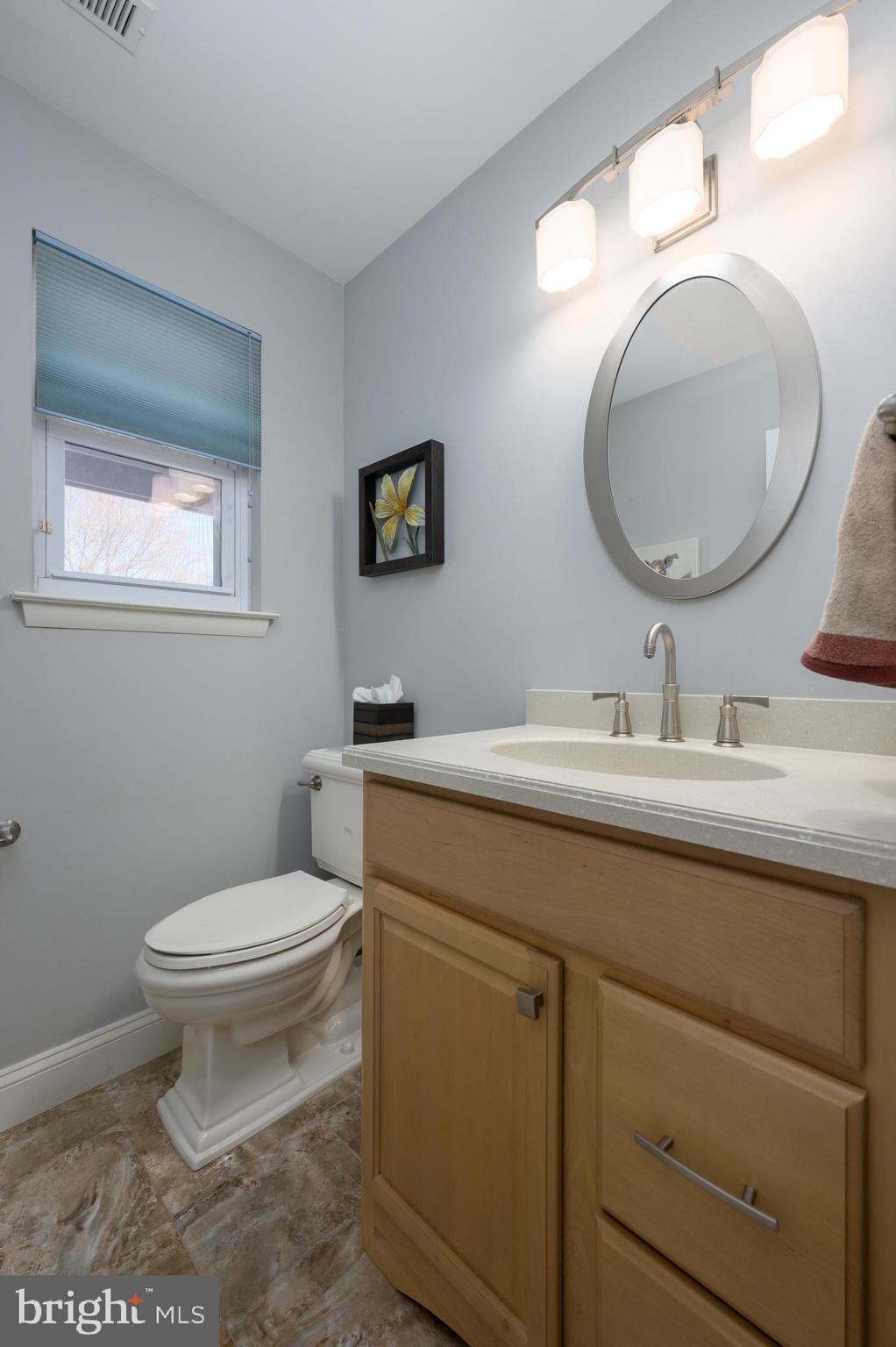 82 Boothby Drive Mount Laurel, NJ 08054 - Photo 11 of 20 a bathroom with a toilet sink vanity and mirror