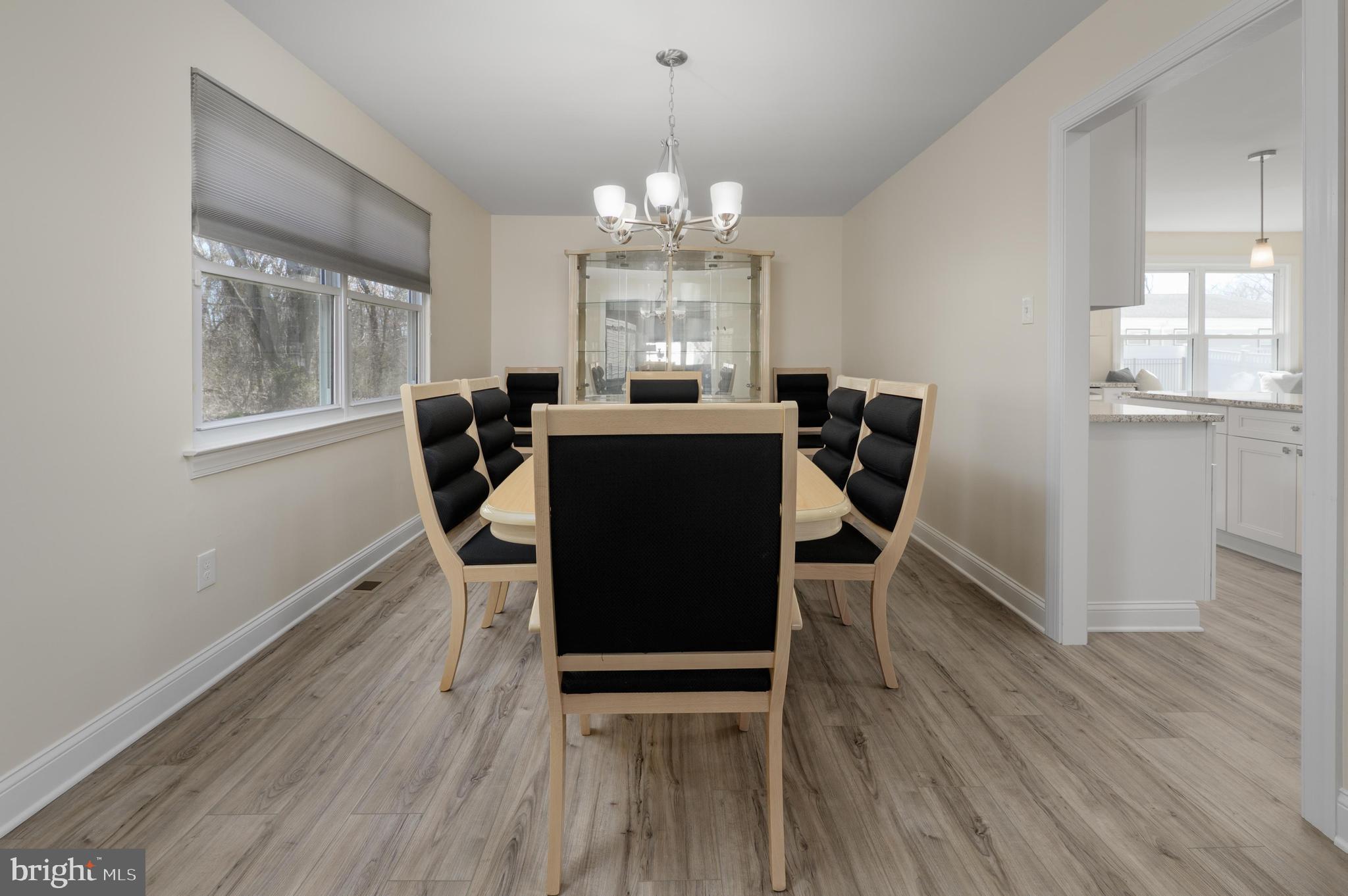 82 Boothby Drive Mount Laurel, NJ 08054 - Photo 5 of 20 a view of a dining room with furniture a chandelier and wooden floor