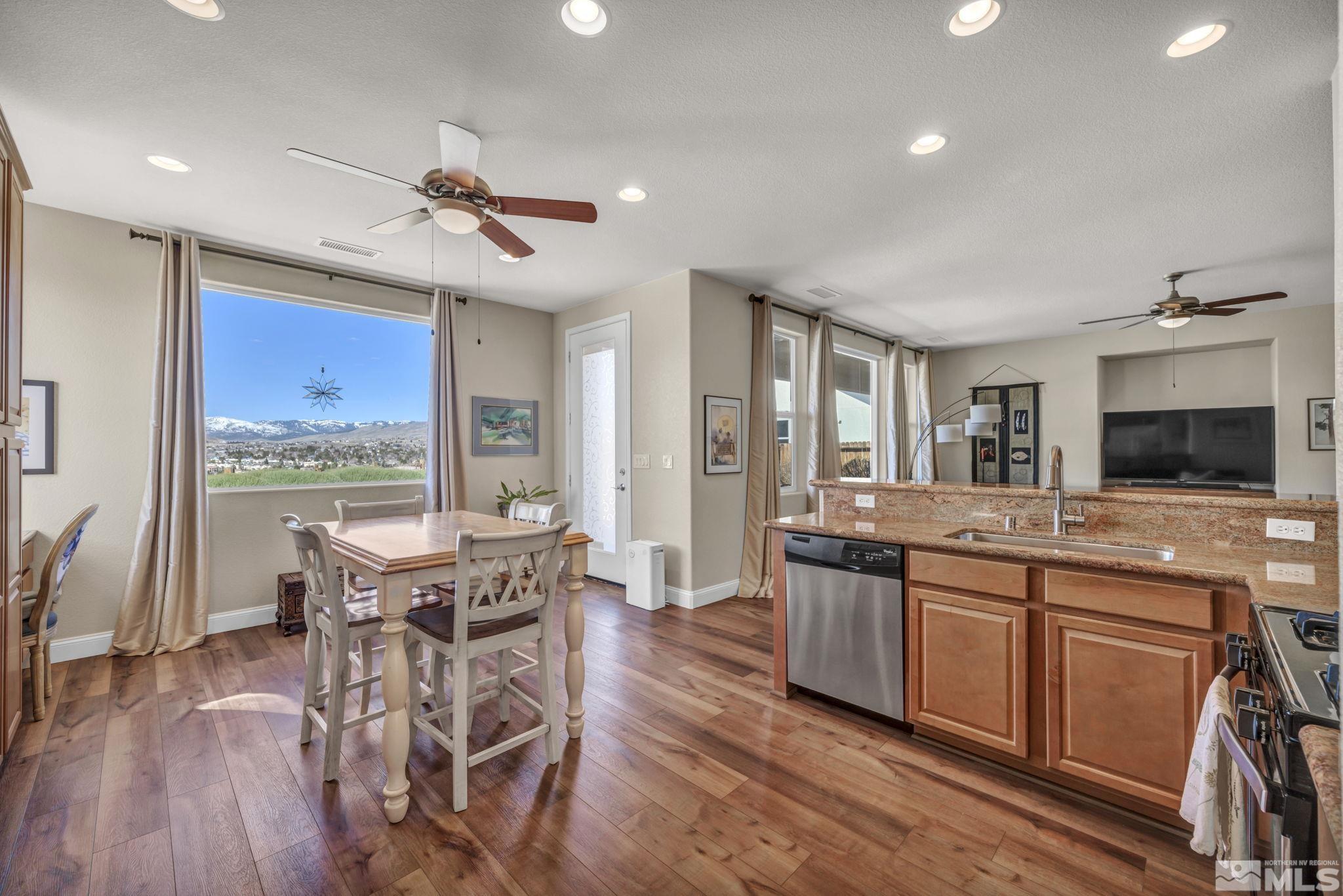 1479 Snow Summit Drive Reno, NV 89523 - Photo 11 of 40 a view of a dining room with furniture window and wooden floor