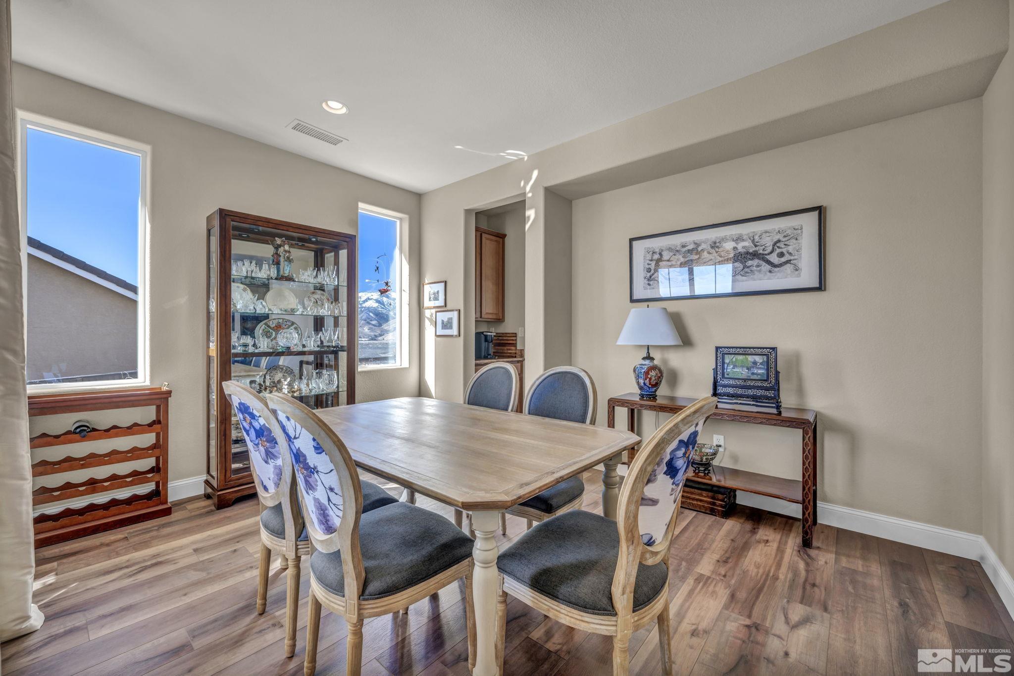 1479 Snow Summit Drive Reno, NV 89523 - Photo 13 of 40 a view of a dining room with furniture and wooden floor