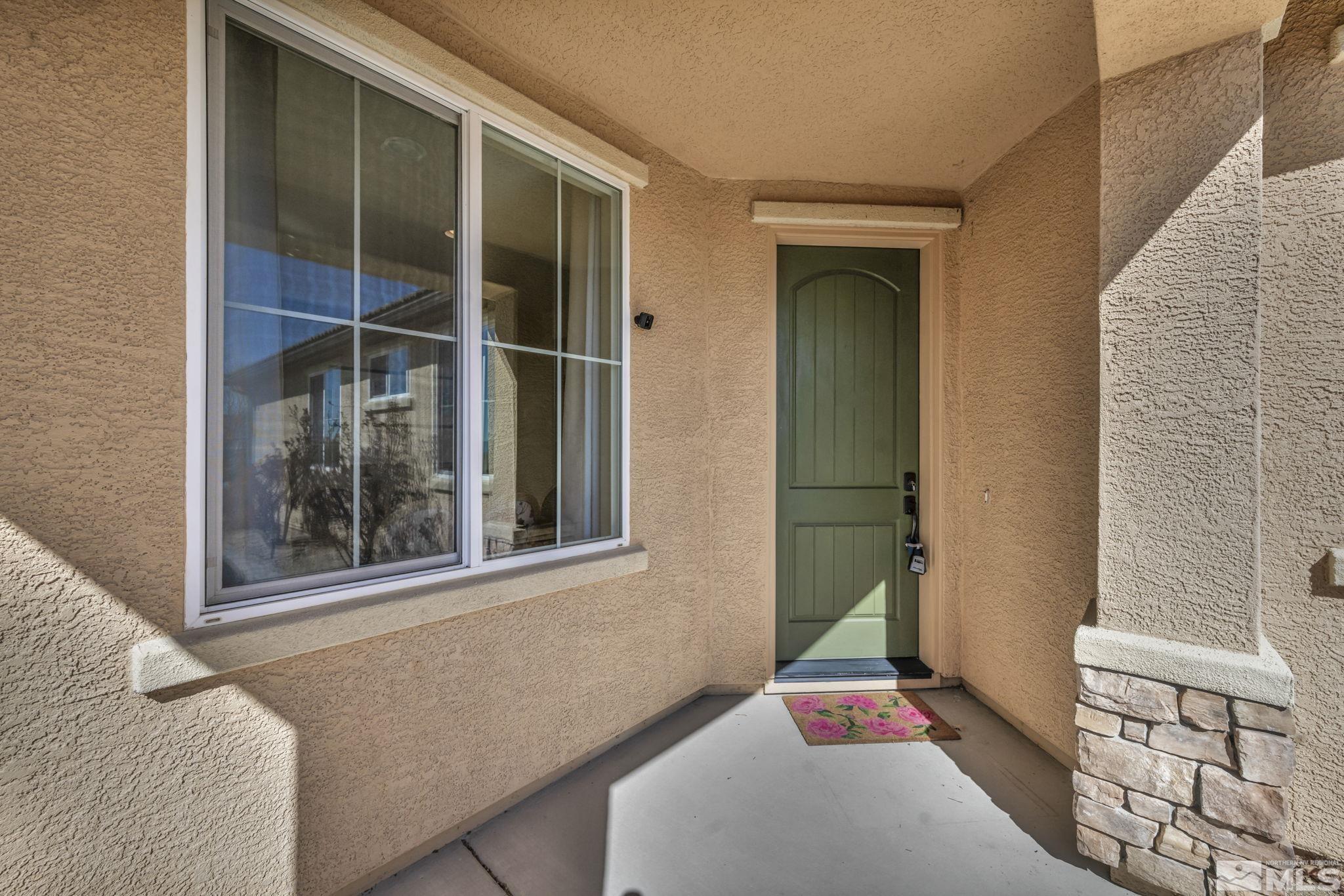 1479 Snow Summit Drive Reno, NV 89523 - Photo 2 of 40 a bedroom with a bed and a window