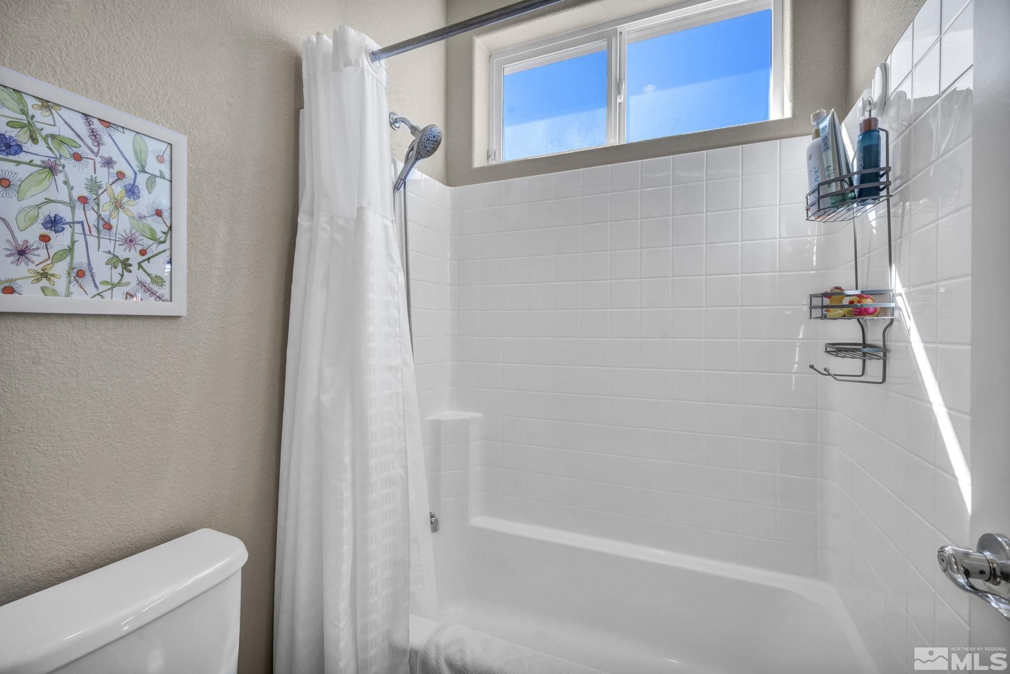 1479 Snow Summit Drive Reno, NV 89523 - Photo 21 of 40 a bathroom with a shower and a toilet