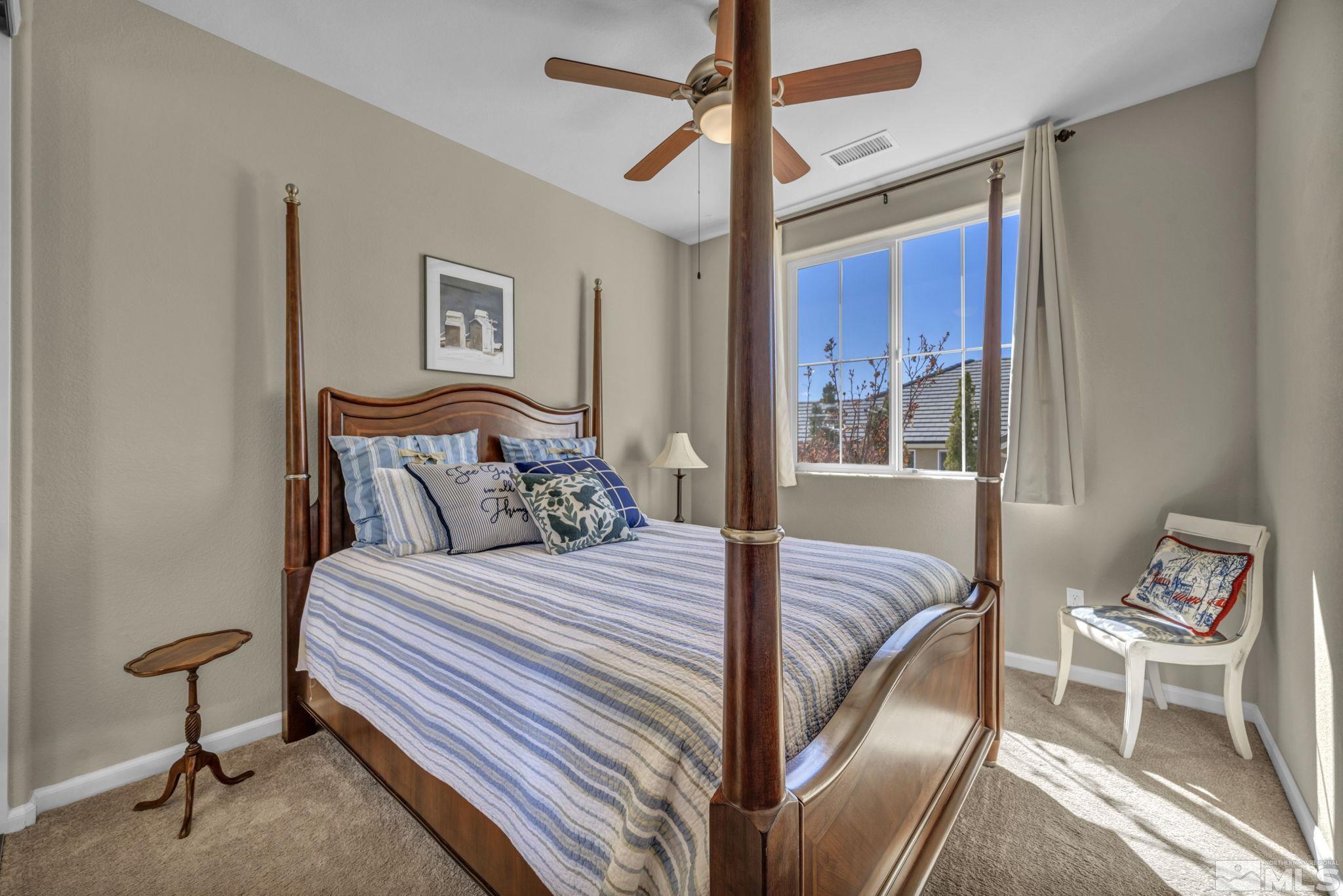 1479 Snow Summit Drive Reno, NV 89523 - Photo 22 of 40 a bedroom with a bed and a window