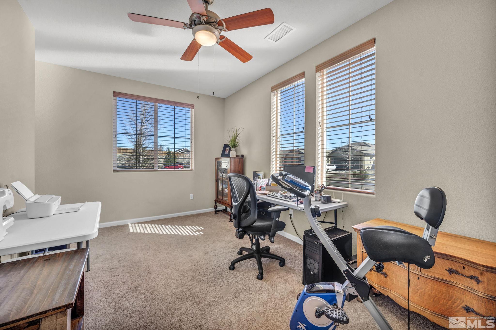 1479 Snow Summit Drive Reno, NV 89523 - Photo 25 of 40 a work room with furniture and windows