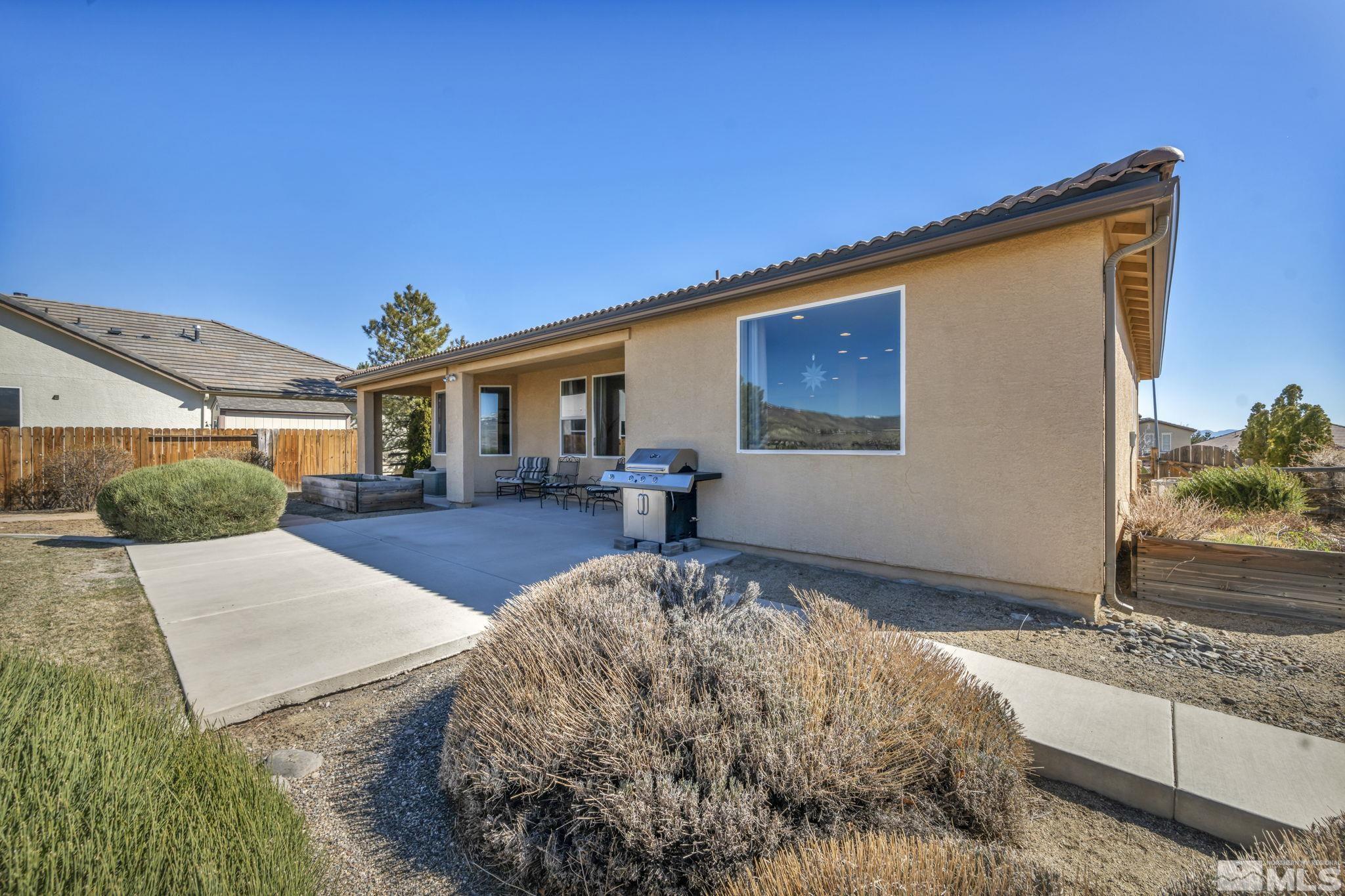 1479 Snow Summit Drive Reno, NV 89523 - Photo 28 of 40 a front view of a house with garden