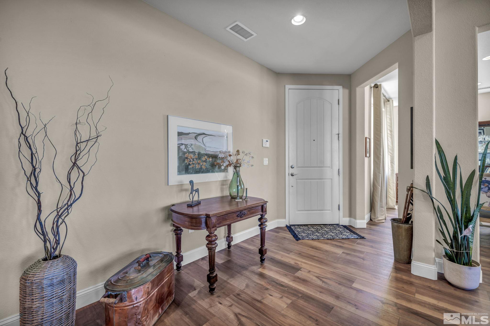 1479 Snow Summit Drive Reno, NV 89523 - Photo 3 of 40 a workspace with furniture and wooden floor