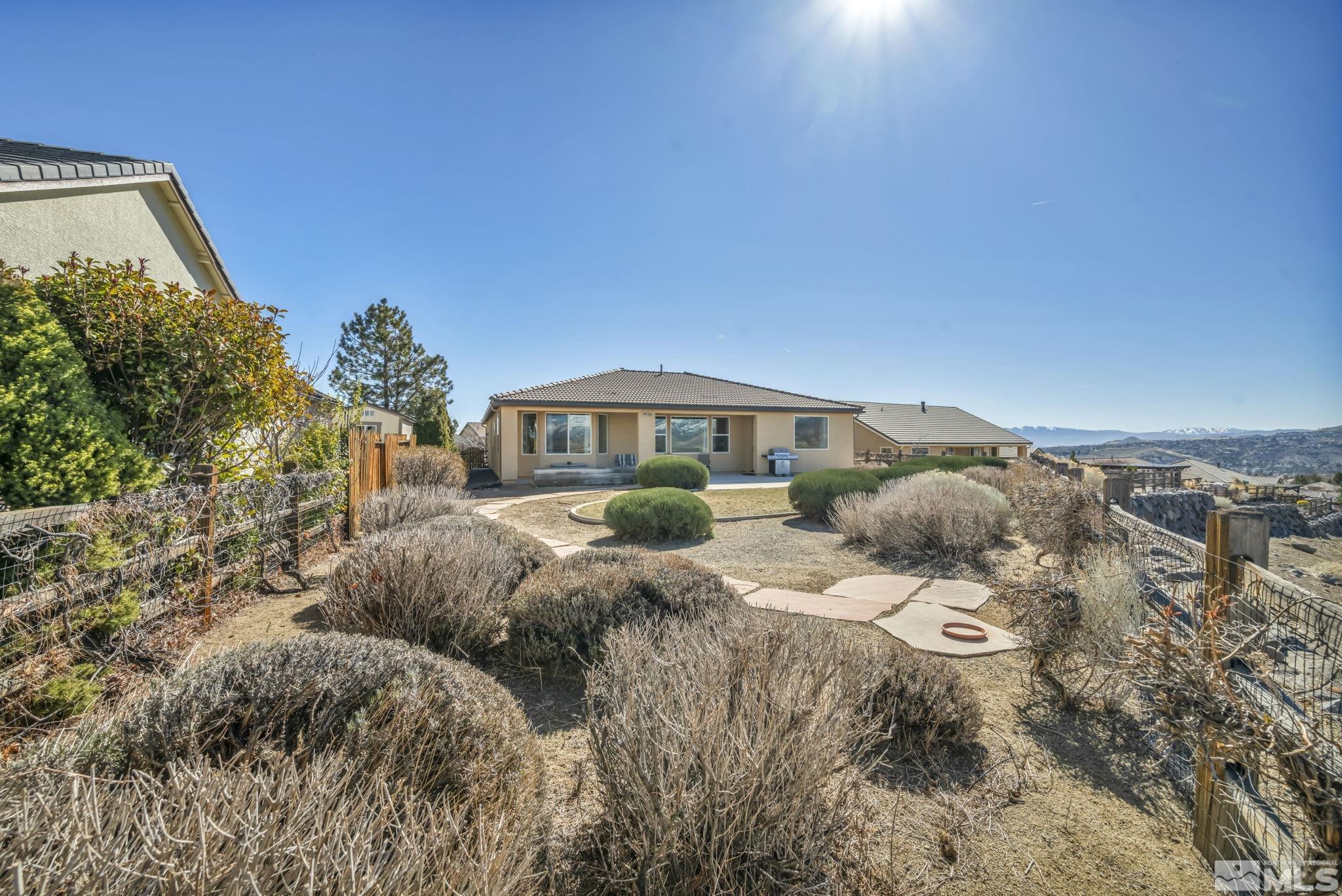 1479 Snow Summit Drive Reno, NV 89523 - Photo 34 of 40 a front view of a house with a yard