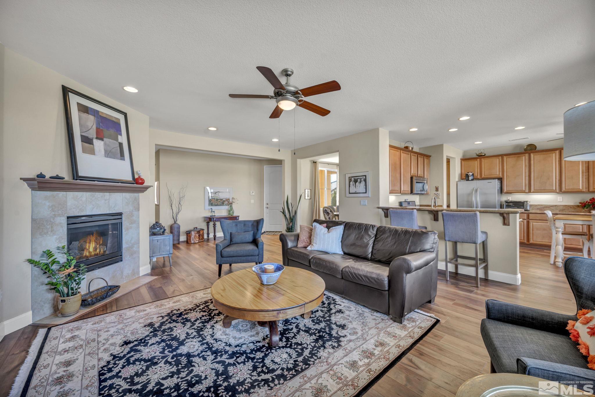 1479 Snow Summit Drive Reno, NV 89523 - Photo 9 of 40 a living room with furniture and a fireplace