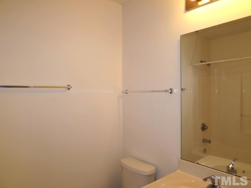 303 Smith Level Road, Unit F11 Chapel Hill, NC 27516 - Photo 7 of 14 a bathroom with a toilet and a shower