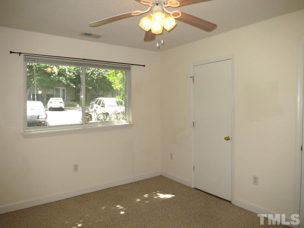 303 Smith Level Road, Unit F11 Chapel Hill, NC 27516 - Photo 9 of 14 a view of an empty room with a window