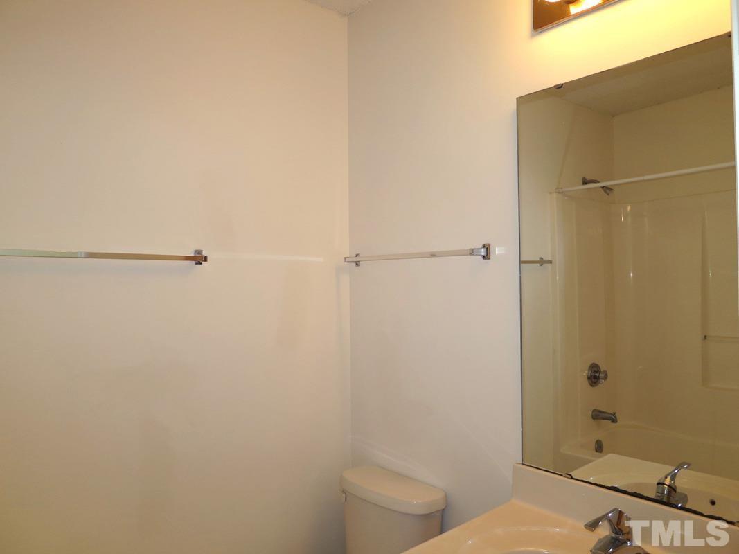 303 Smith Level Road, Unit F11 Chapel Hill, NC 27516 - Photo 10 of 14 a bathroom with a toilet and a shower