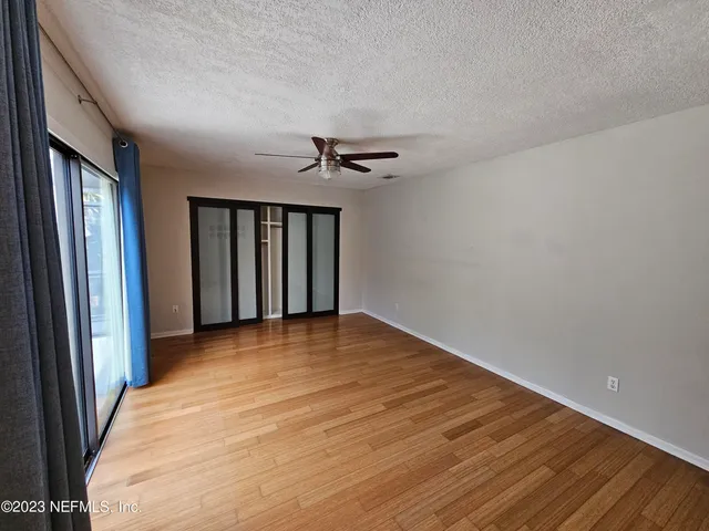 a bathroom with a toilet sink double vanity and shower