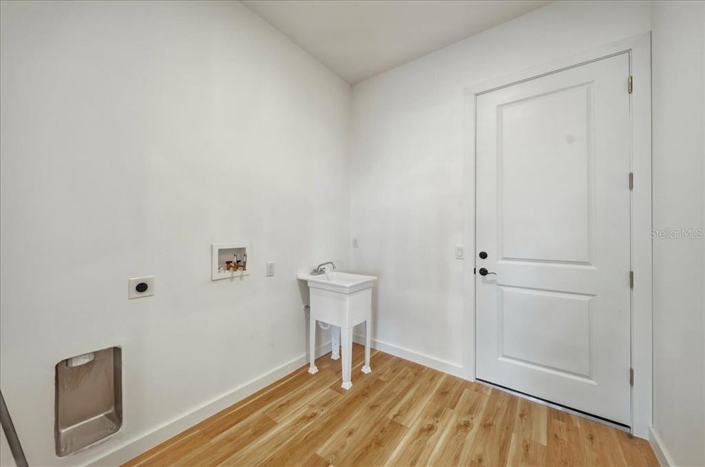 1215 Rio De Janeiro Avenue Punta Gorda, FL 33983 - Photo 58 of 65 a room that has a bed and a chair in it