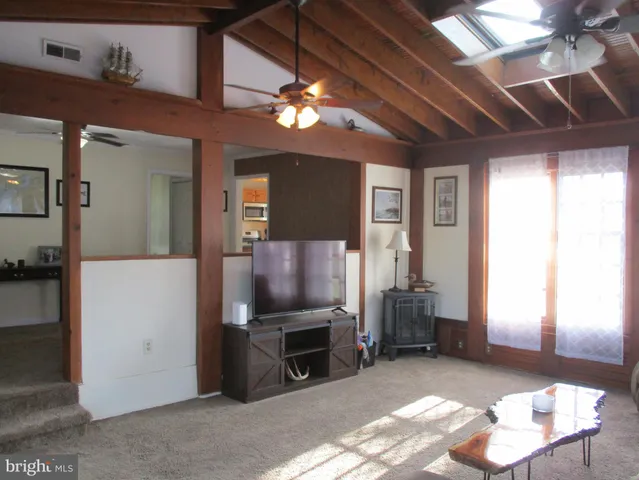 a view of a livingroom with furniture and a chandelier