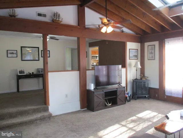 a view of a livingroom with furniture and a fireplace