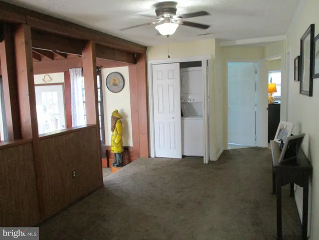 a view of a hallway with a chandelier