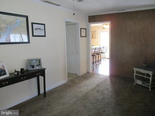 a view of empty room with furniture and window