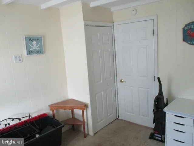 a view of a bedroom with baby bed
