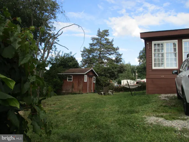 a view of backyard with a garden and plants