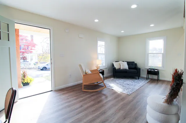 a kitchen with stainless steel appliances a sink a stove a refrigerator and cabinets
